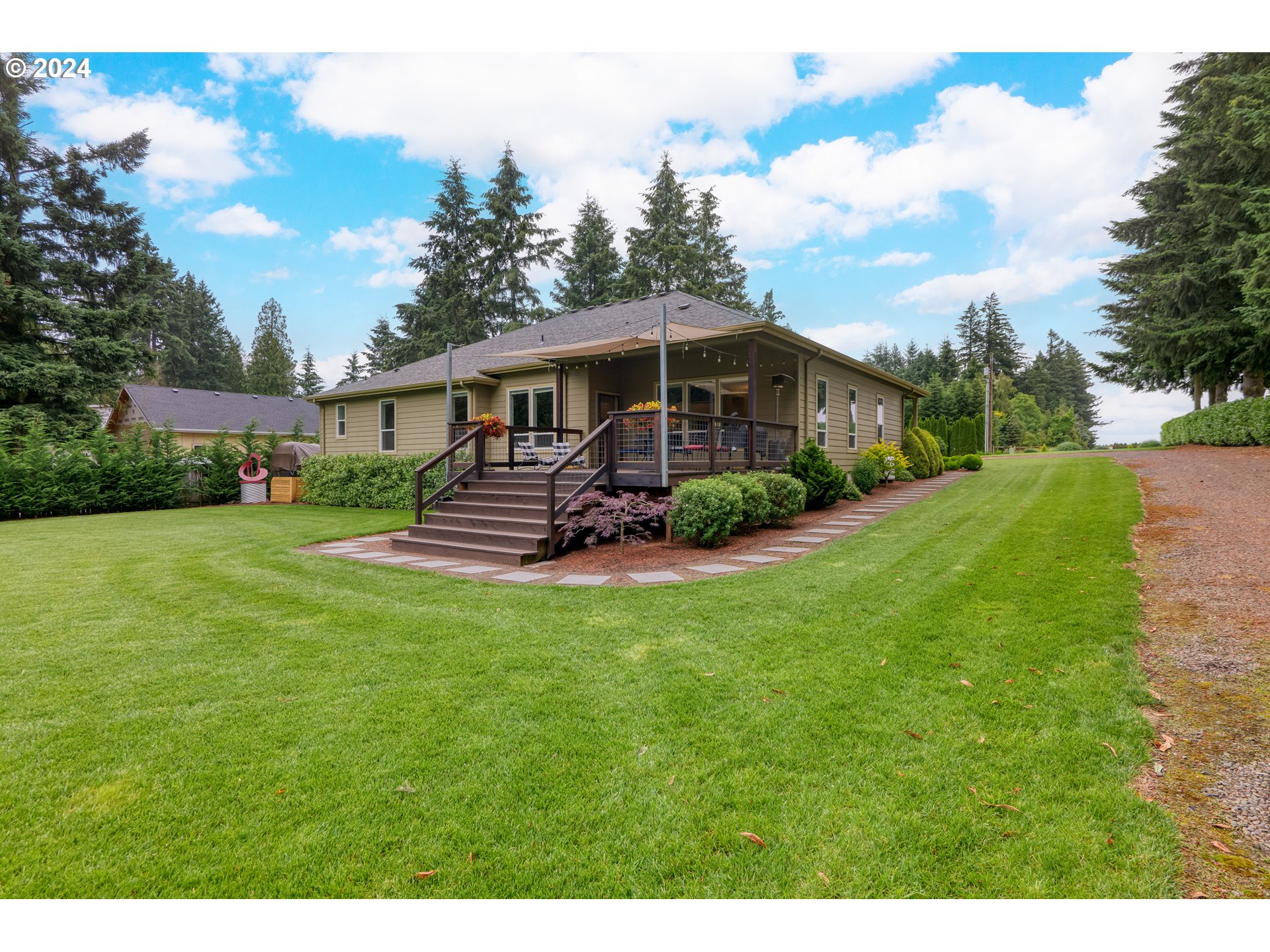 25595 South Rhoten Road Aurora, OR 97002 - Photo 30 of 48 a view of a house with a backyard