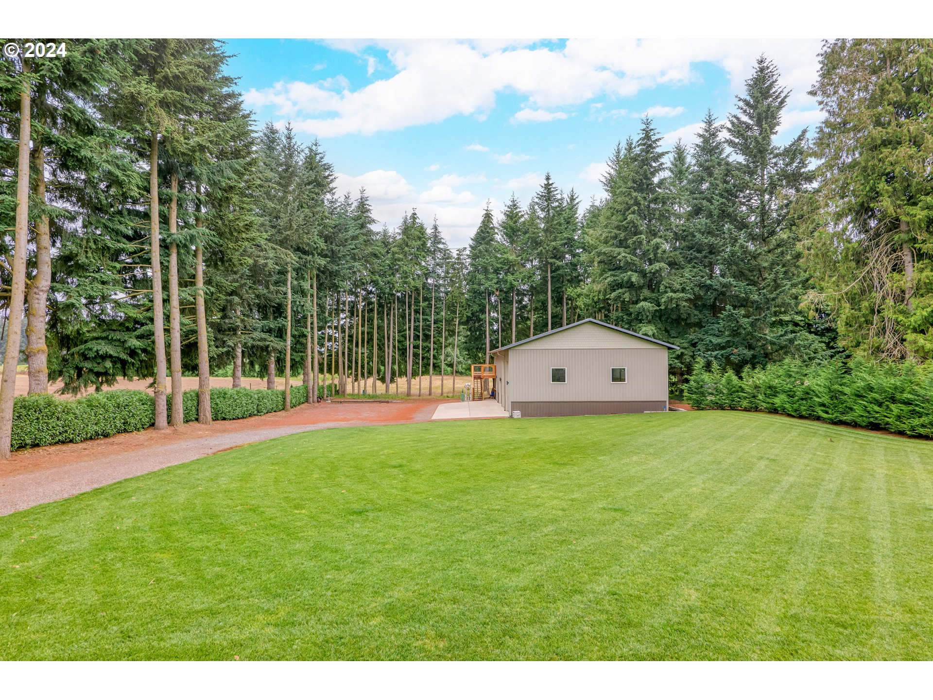 25595 South Rhoten Road Aurora, OR 97002 - Photo 33 of 48 a view of a large garden with large trees