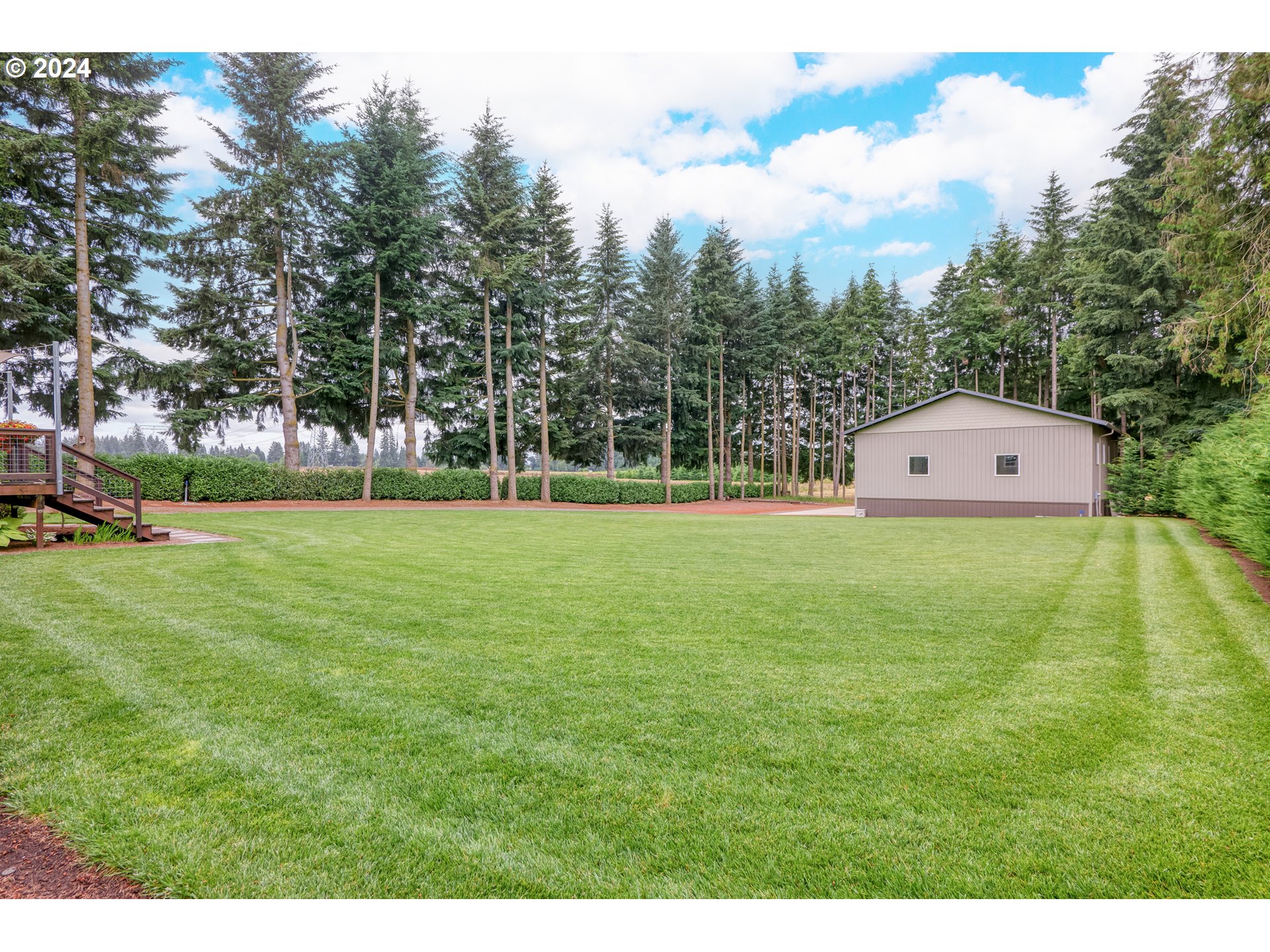 25595 South Rhoten Road Aurora, OR 97002 - Photo 35 of 48 a front view of a house with a yard
