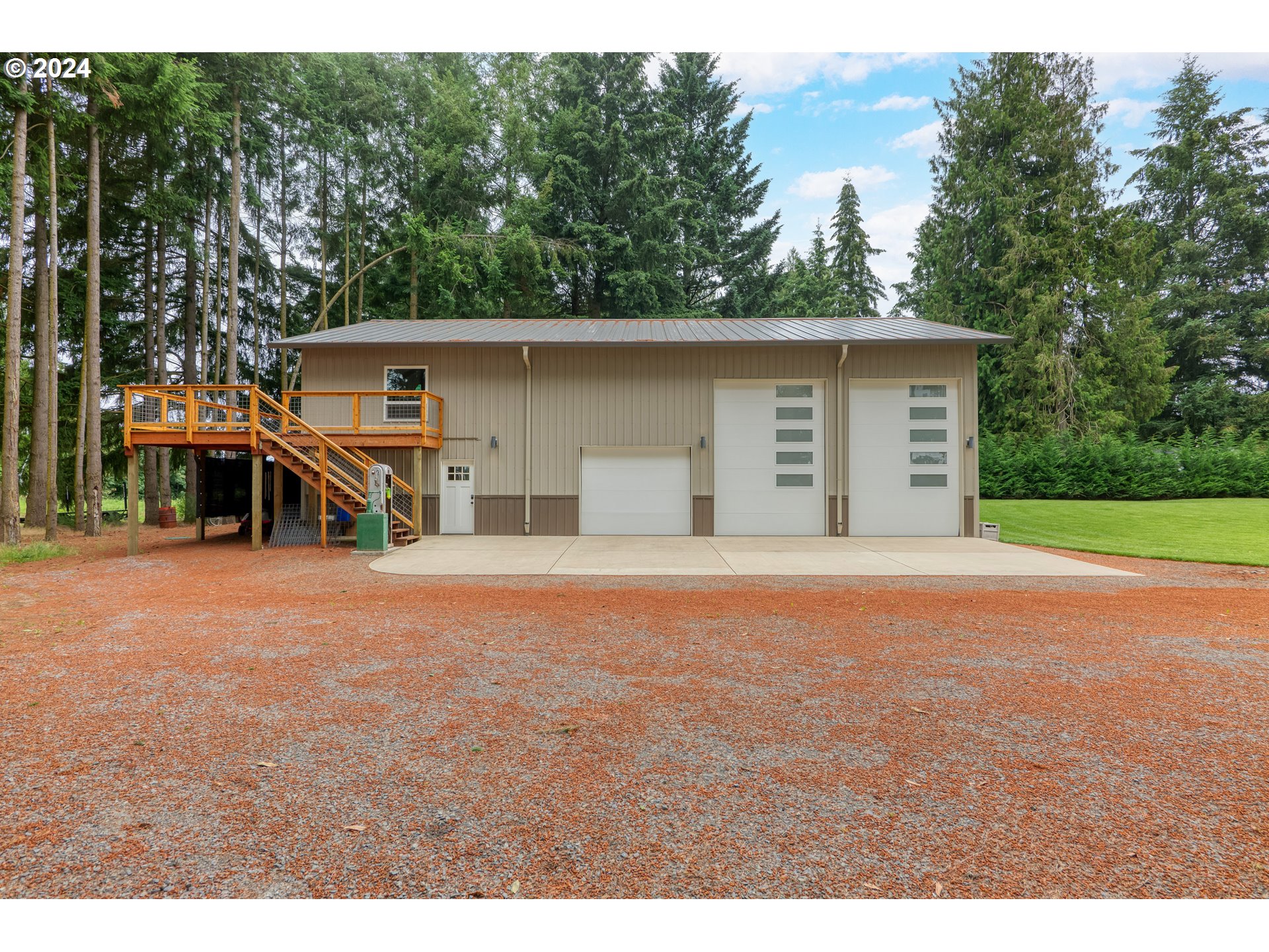25595 South Rhoten Road Aurora, OR 97002 - Photo 37 of 48 a view of a house with a yard and garage