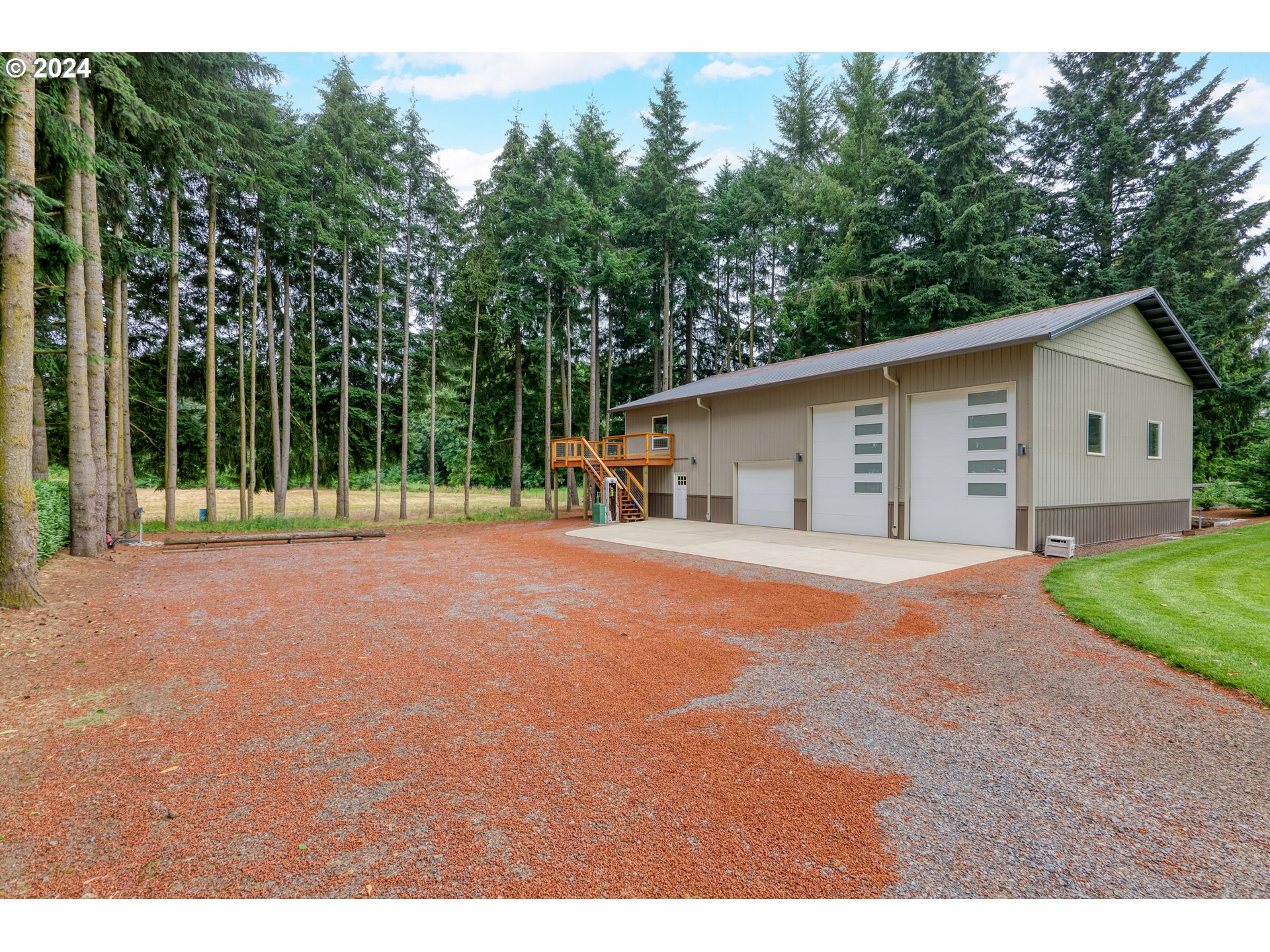 25595 South Rhoten Road Aurora, OR 97002 - Photo 38 of 48 a view of a house with backyard and trees