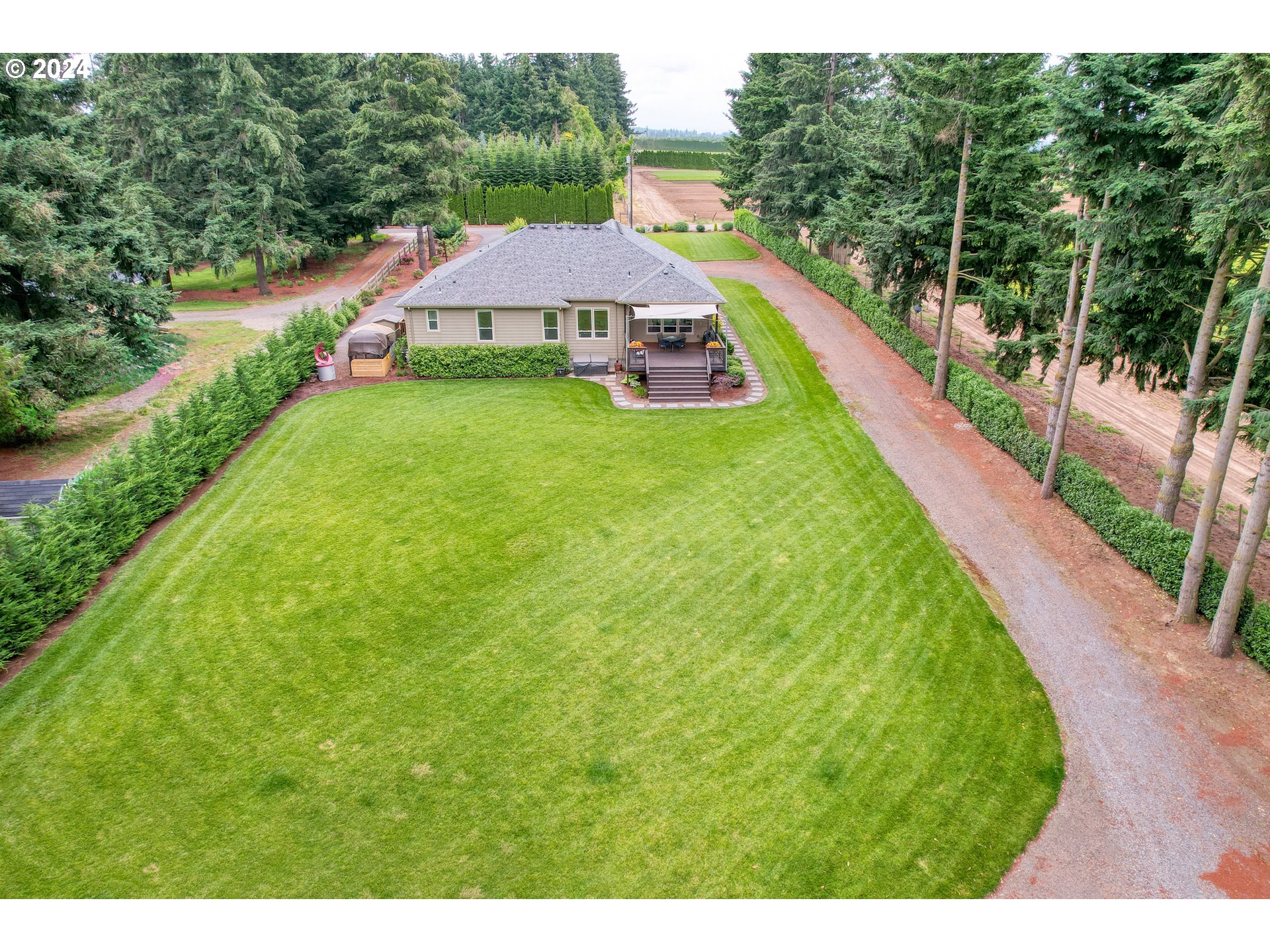 25595 South Rhoten Road Aurora, OR 97002 - Photo 44 of 48 a view of a house with a yard