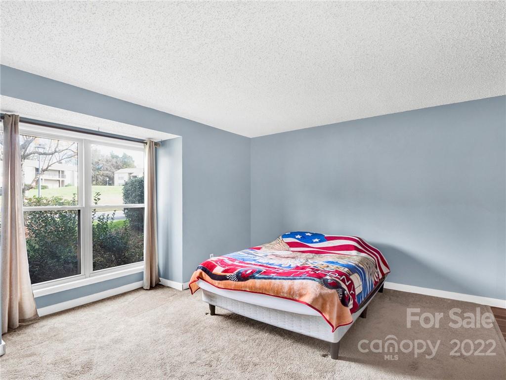 11060 Running Ridge Road Charlotte, NC 28226 - Photo 11 of 16 a bedroom with a bed and a window