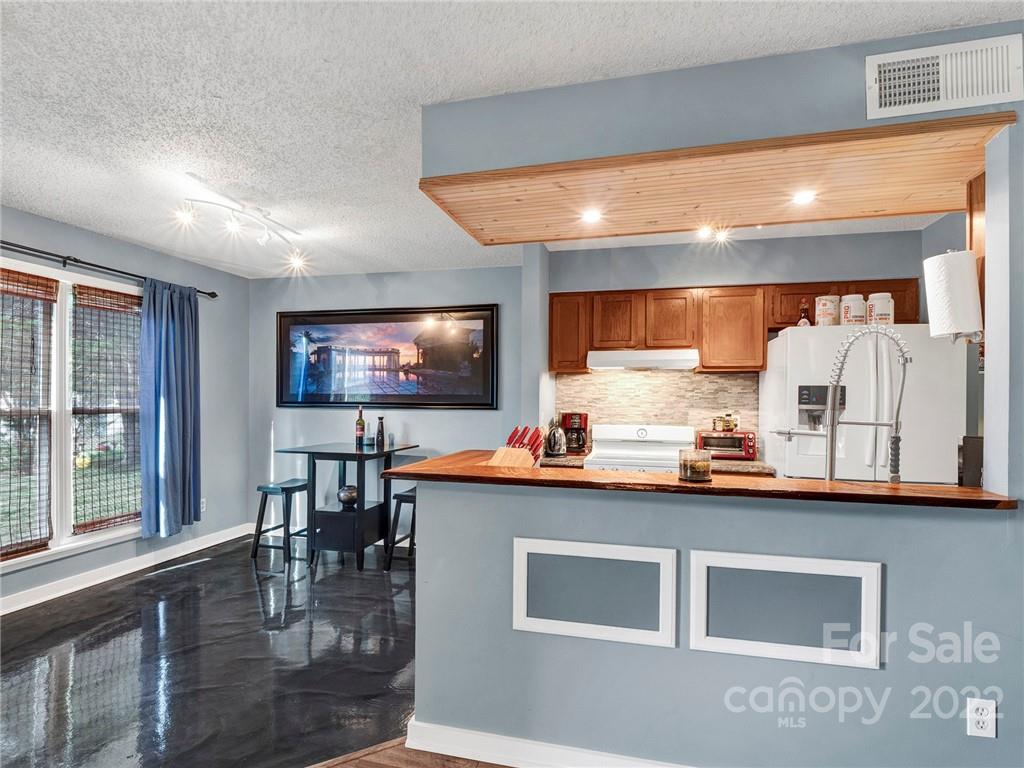 11060 Running Ridge Road Charlotte, NC 28226 - Photo 6 of 16 a room with furniture and a flat screen tv