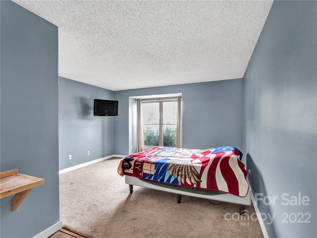 11060 Running Ridge Road Charlotte, NC 28226 - Photo 10 of 16 a bedroom with a bed and window