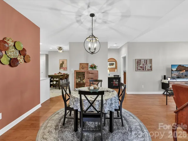 a kitchen with stainless steel appliances a refrigerator sink and cabinets
