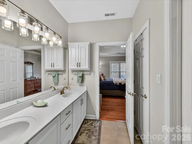 a bedroom with a bed and a book shelf