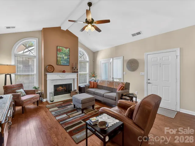 a living room with furniture and a rug