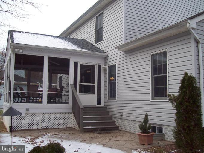 603 Pasture Brook Road Severn, MD 21144 - Photo 2 of 22 a view of a patio with table and chairs