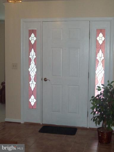603 Pasture Brook Road Severn, MD 21144 - Photo 11 of 22 a view of a livingroom with window and flower pot