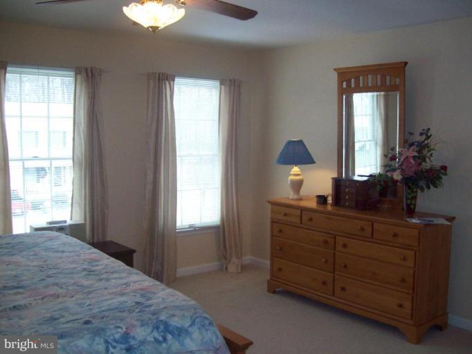603 Pasture Brook Road Severn, MD 21144 - Photo 13 of 22 a bedroom with a bed and a dresser
