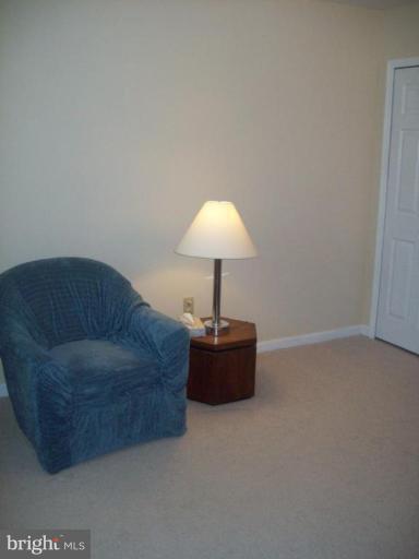 603 Pasture Brook Road Severn, MD 21144 - Photo 14 of 22 a living room with a couch and a lamp