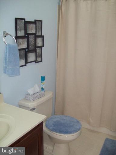 603 Pasture Brook Road Severn, MD 21144 - Photo 19 of 22 a bathroom with a sink toilet and shower