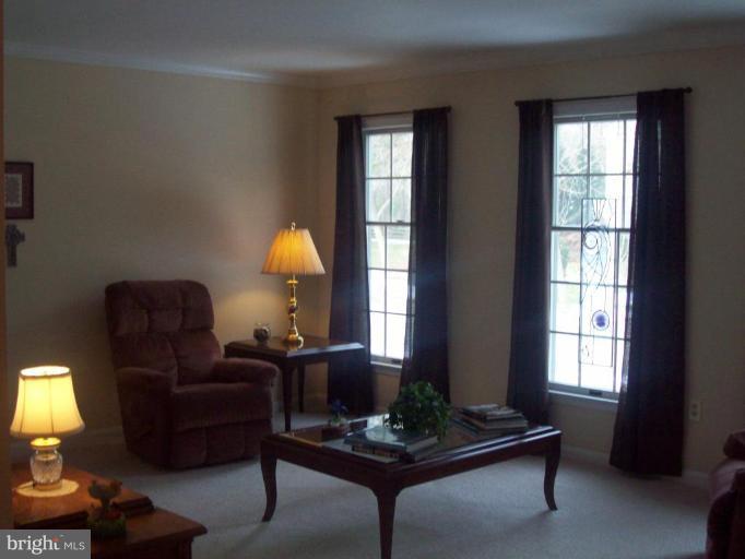 603 Pasture Brook Road Severn, MD 21144 - Photo 3 of 22 a living room with furniture and a window