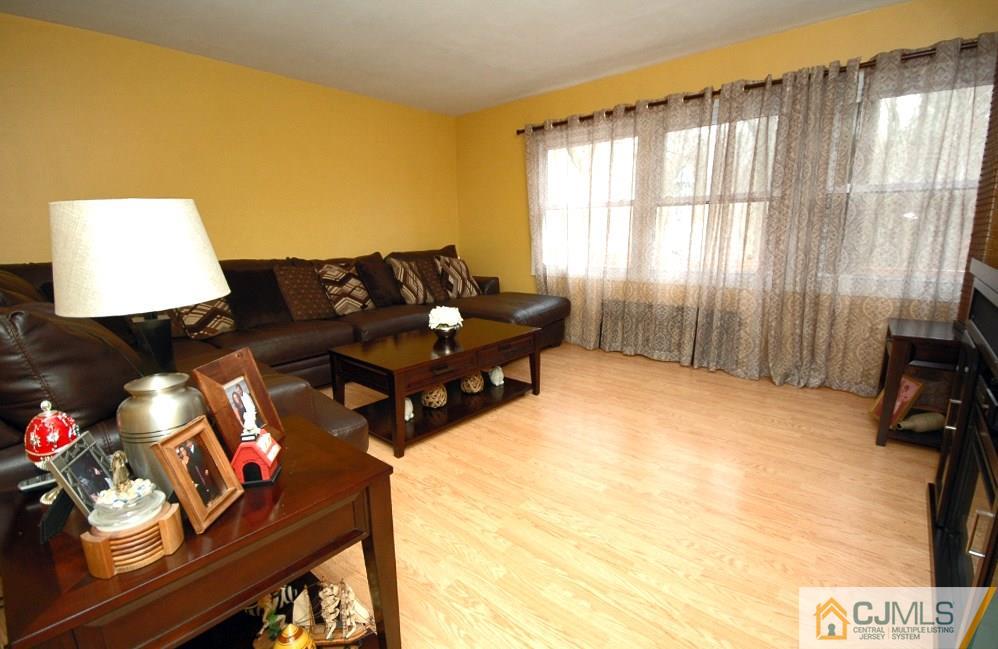 3066 Cheesequake Road Old Bridge, NJ 08859 - Photo 3 of 24 a living room with furniture and a window