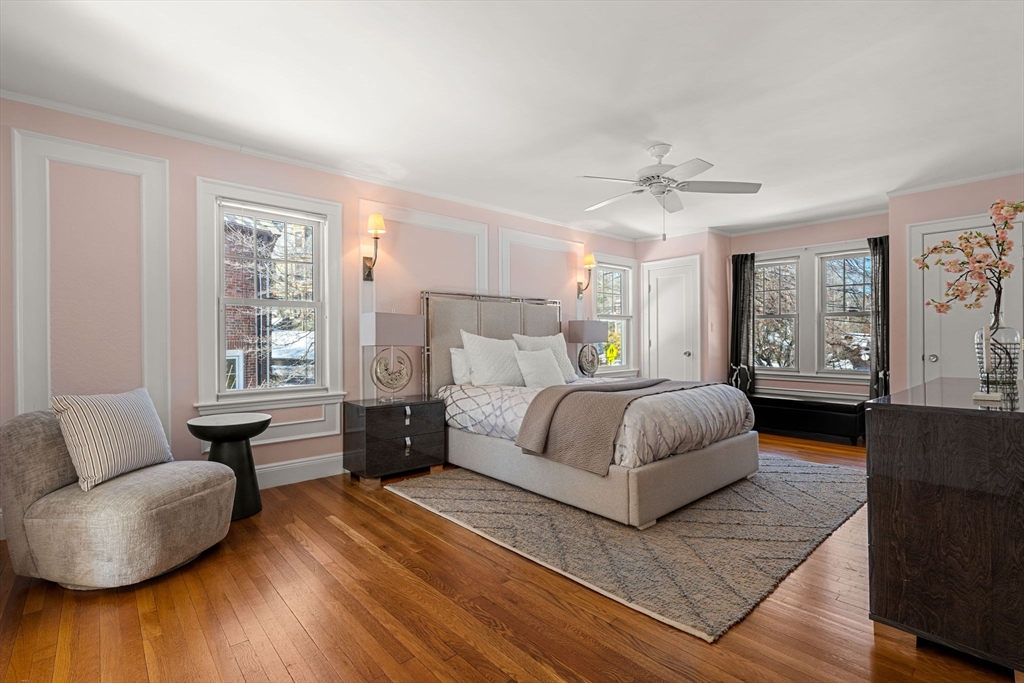 24 Blake Road Brookline, MA 02445 - Photo 19 of 40 a bedroom with a large bed couch and windows