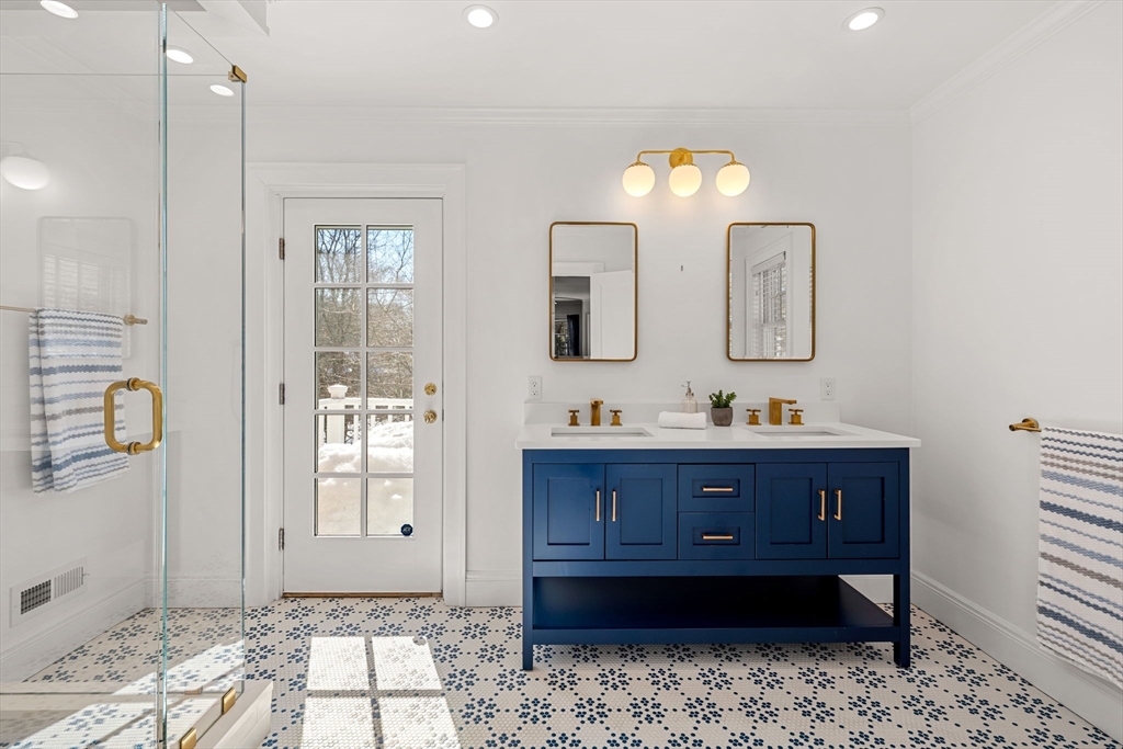 24 Blake Road Brookline, MA 02445 - Photo 22 of 40 a bathroom with a sink mirror and vanity