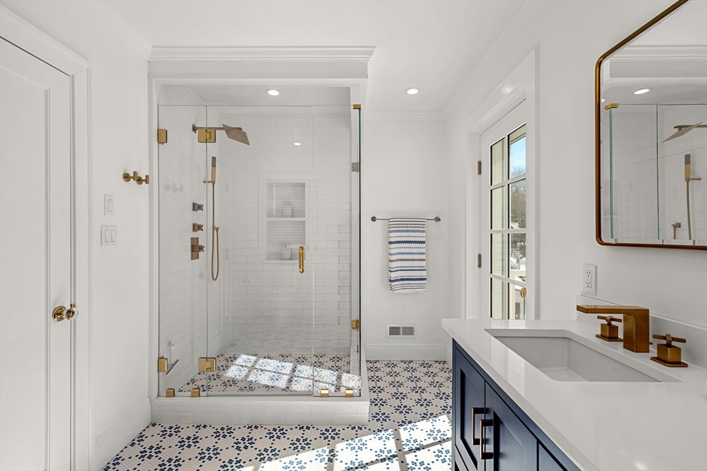 24 Blake Road Brookline, MA 02445 - Photo 23 of 40 a bathroom with a sink and a mirror