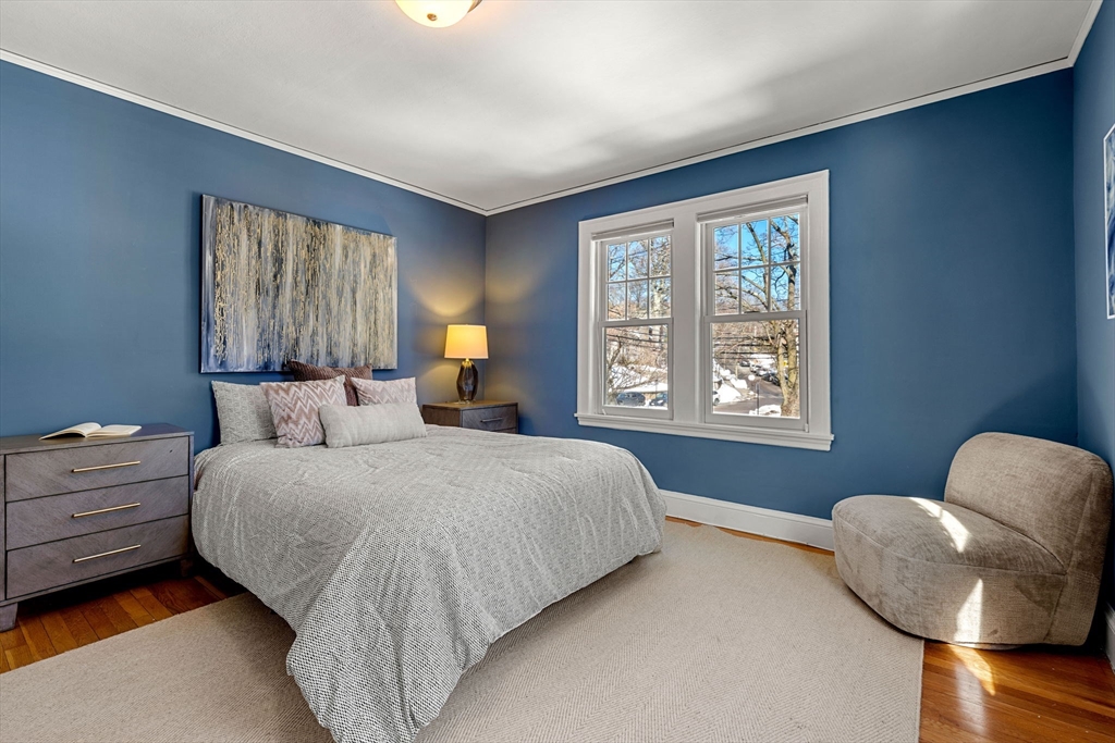 24 Blake Road Brookline, MA 02445 - Photo 28 of 40 a spacious bedroom with a bed and window