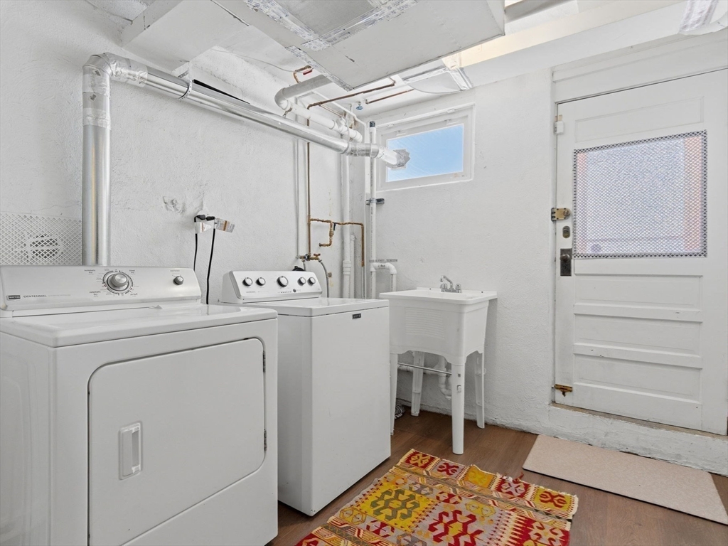 24 Blake Road Brookline, MA 02445 - Photo 35 of 40 a utility room with a sink dryer and washer