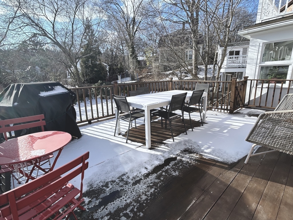 24 Blake Road Brookline, MA 02445 - Photo 36 of 40 a view of a patio with a bench