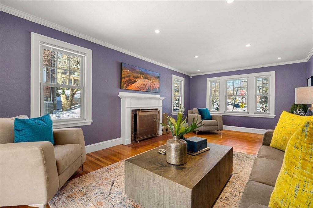 24 Blake Road Brookline, MA 02445 - Photo 4 of 40 a living room with furniture a window and a fireplace