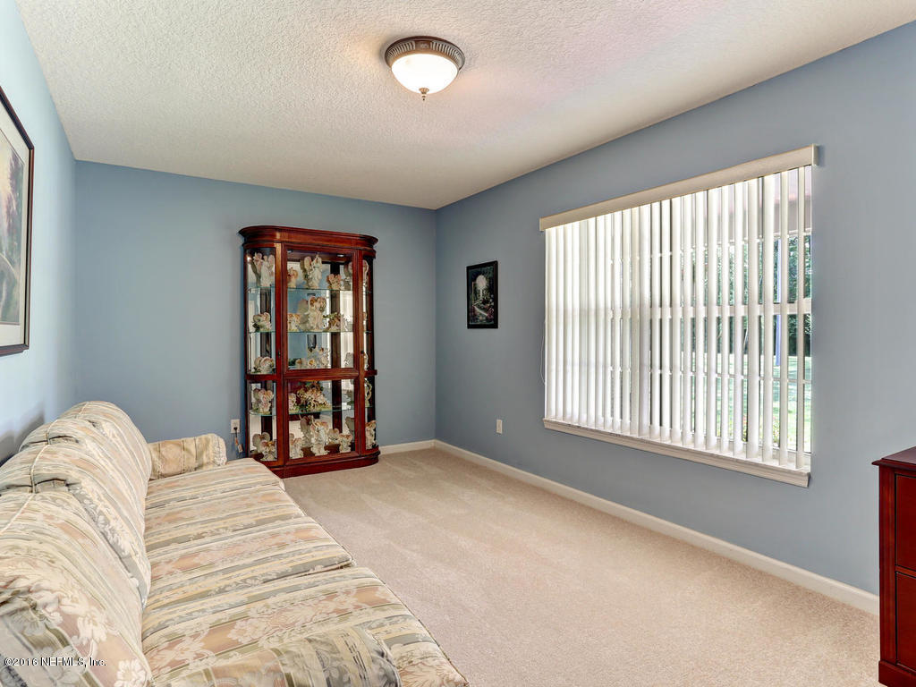 45227 Stratton Road Callahan, FL 32011 - Photo 3 of 42 a bedroom with a bed and a window