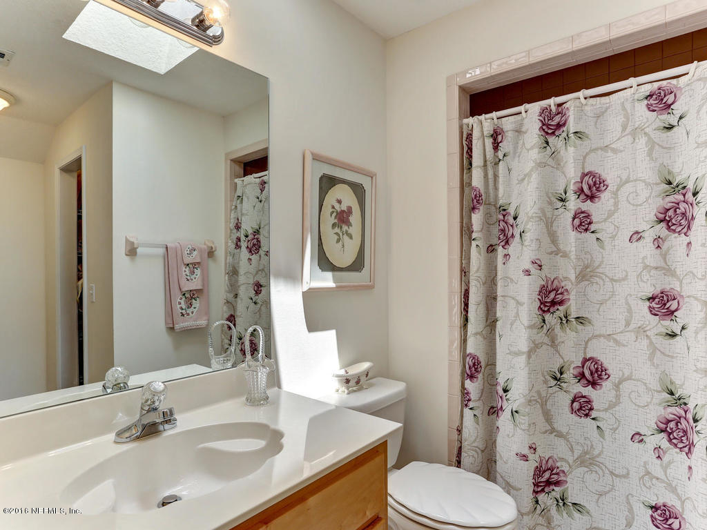 45227 Stratton Road Callahan, FL 32011 - Photo 31 of 42 a bathroom with a sink and a mirror