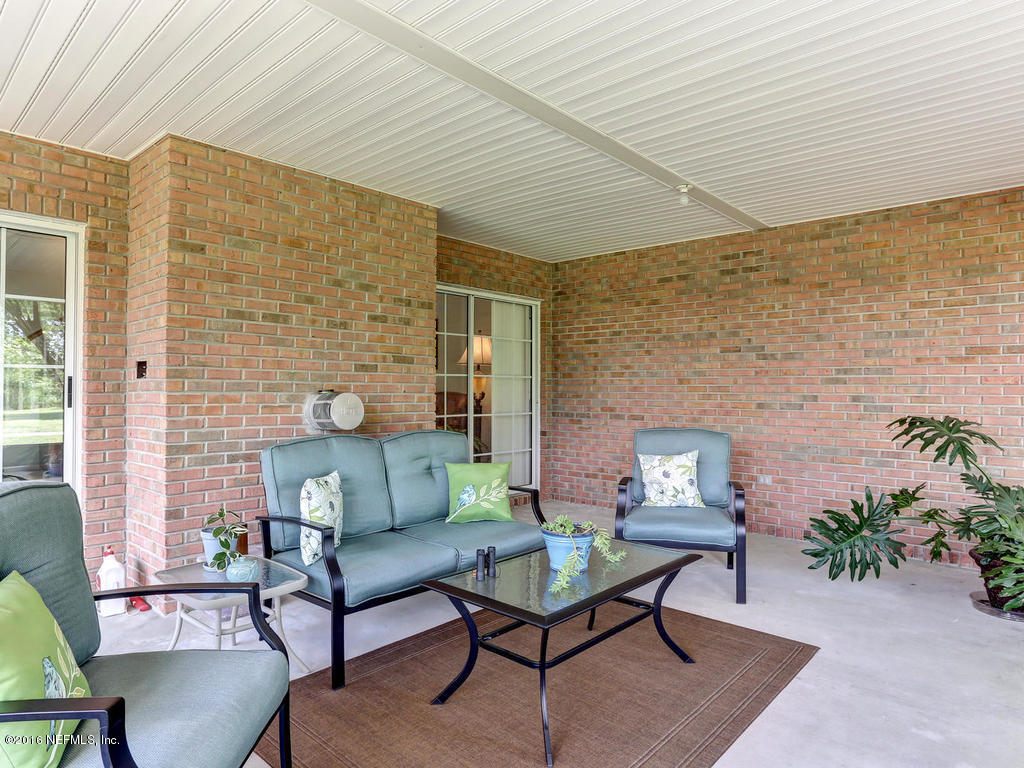 45227 Stratton Road Callahan, FL 32011 - Photo 33 of 42 a outdoor living space with furniture and potted plants