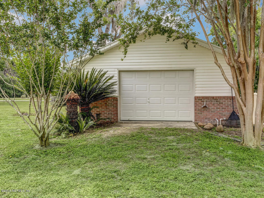 45227 Stratton Road Callahan, FL 32011 - Photo 36 of 42 a front view of a house with a garden