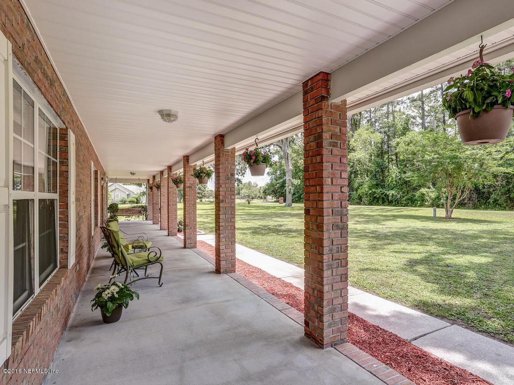 45227 Stratton Road Callahan, FL 32011 - Photo 40 of 42 a view of a porch with furniture and garden