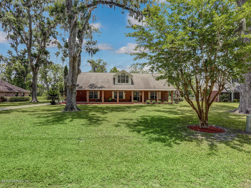 45227 Stratton Road Callahan, FL 32011 - Photo 42 of 42 a front view of a house with garden