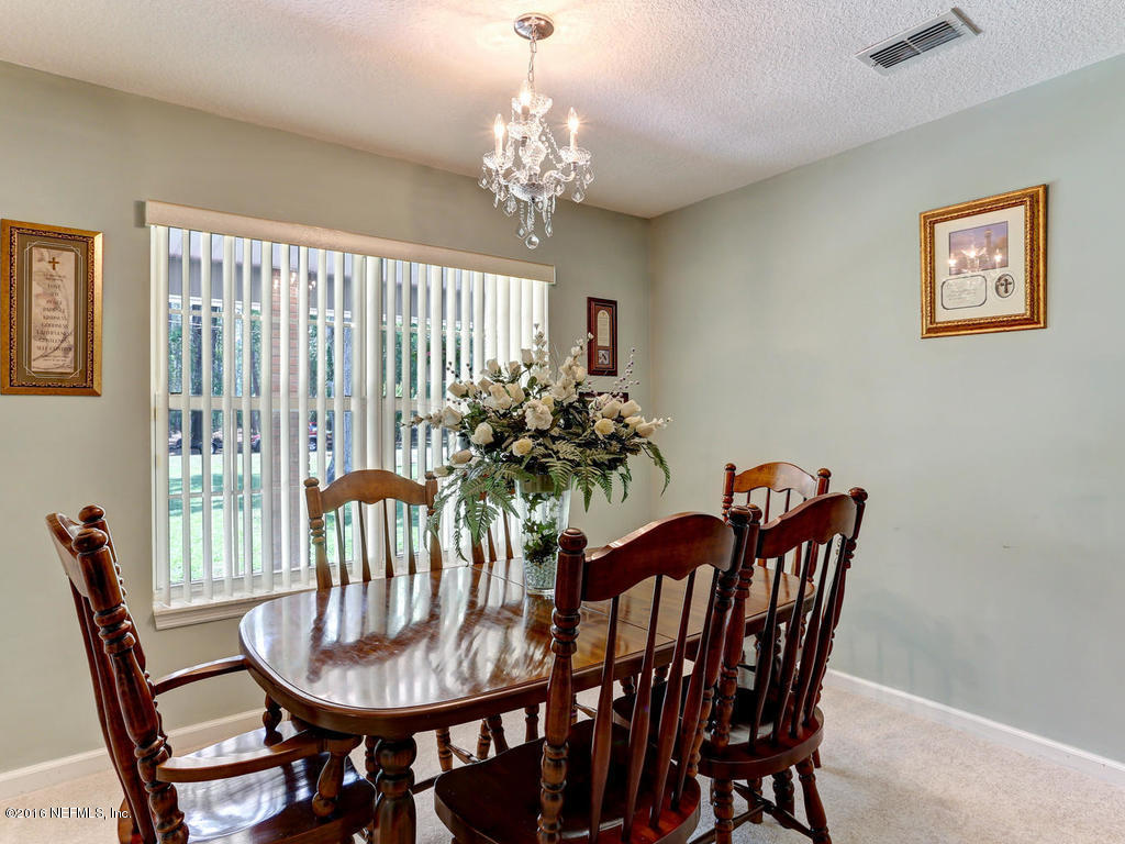 45227 Stratton Road Callahan, FL 32011 - Photo 6 of 42 a view of a dining room with furniture window and wooden floor