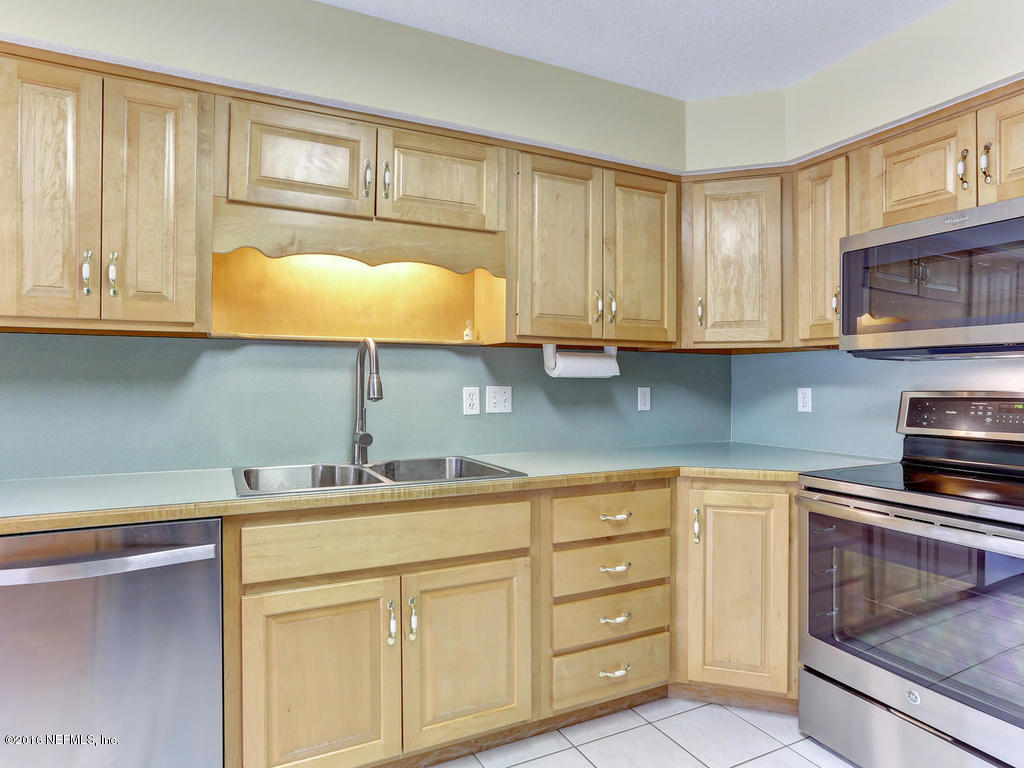 45227 Stratton Road Callahan, FL 32011 - Photo 9 of 42 a kitchen with cabinets appliances and a sink