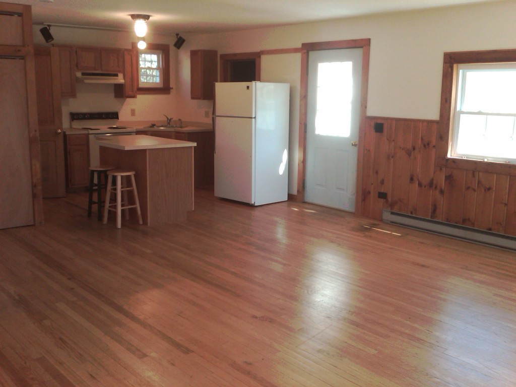 465 Main Road Monterey, MA 01245 - Photo 5 of 6 a kitchen with refrigerator and wooden floor