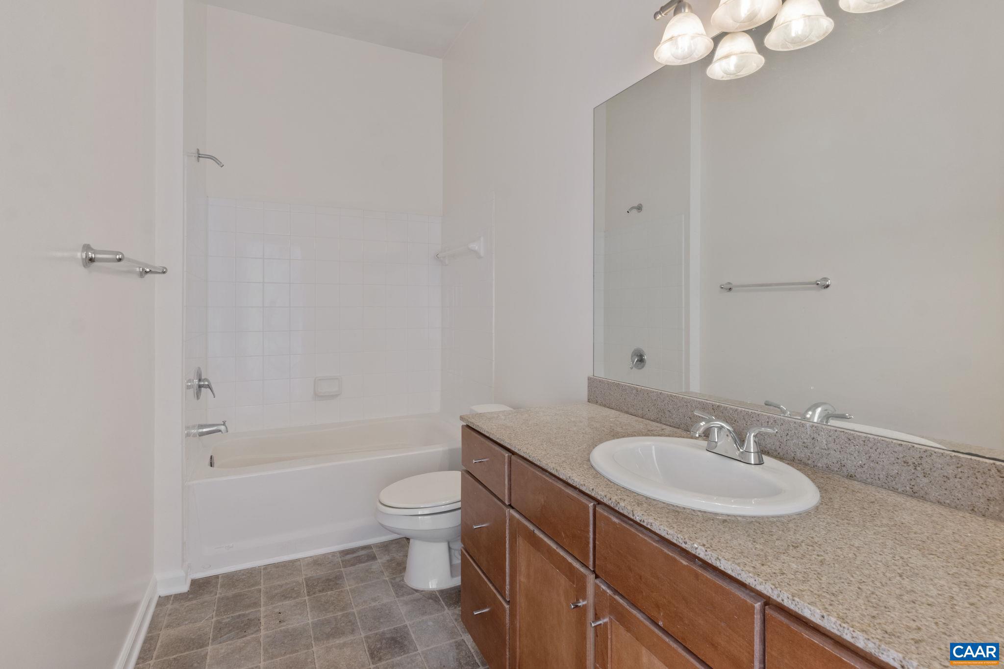765 Walker Square, Unit 4B Charlottesville, VA 22903 - Photo 17 of 17 a bathroom with a sink a toilet and shower