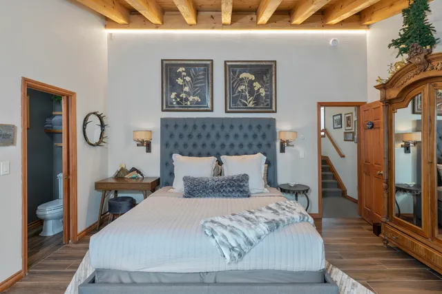 a living room with furniture a window and a flat screen tv