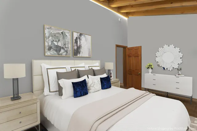 a kitchen with sink a refrigerator and chairs