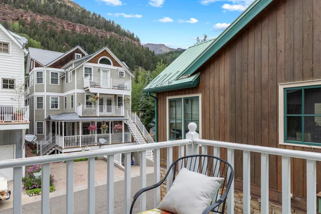 a kitchen with furniture and a chandelier