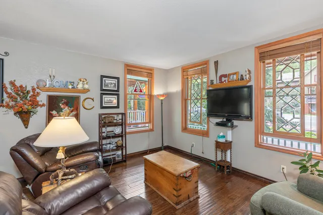 a very nice looking dining room with kitchen island furniture and a chandelier