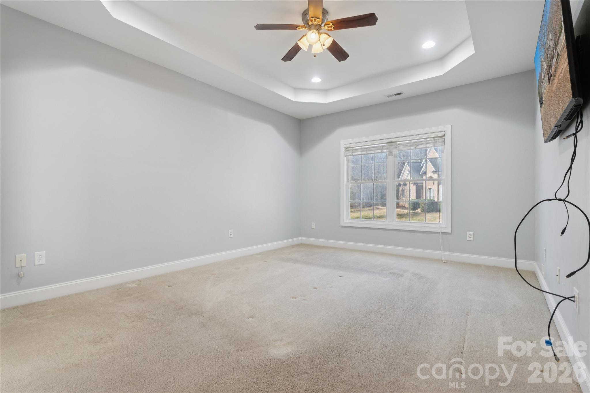 1308 Kerrington Way Clover, SC 29710 - Photo 14 of 33 an empty room with windows and fan