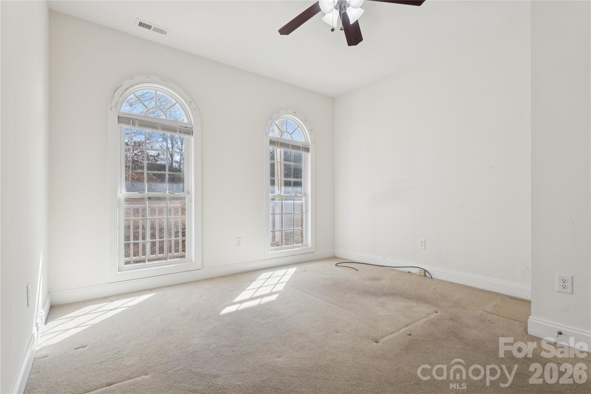 1308 Kerrington Way Clover, SC 29710 - Photo 20 of 33 an empty room with windows and fan