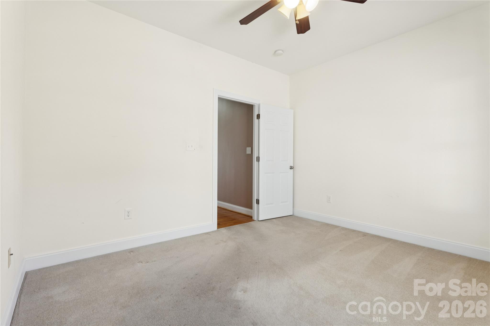1308 Kerrington Way Clover, SC 29710 - Photo 22 of 33 an empty room with a ceiling fan and a window