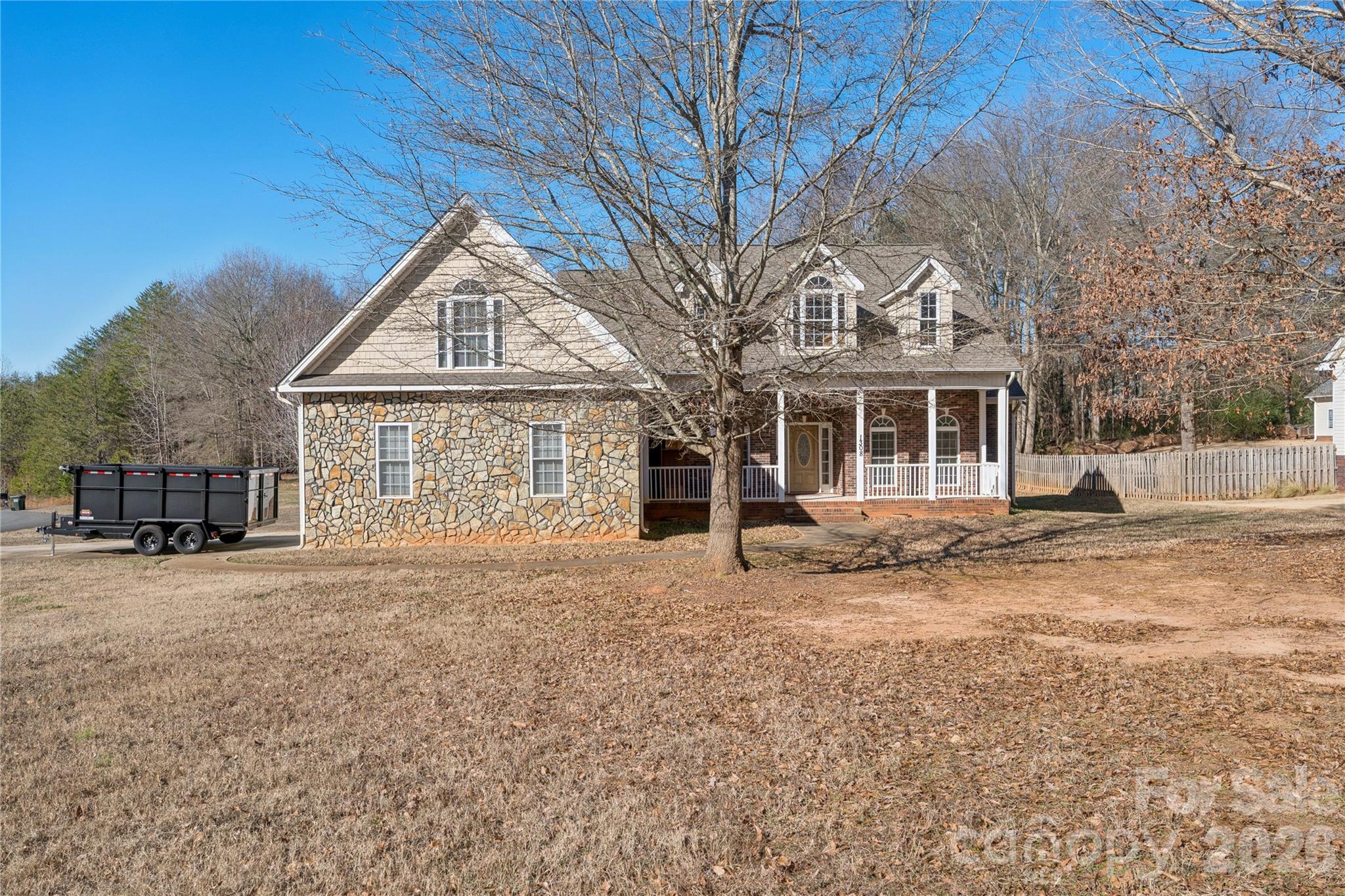 1308 Kerrington Way Clover, SC 29710 - Photo 24 of 33 a front view of a house with a garden