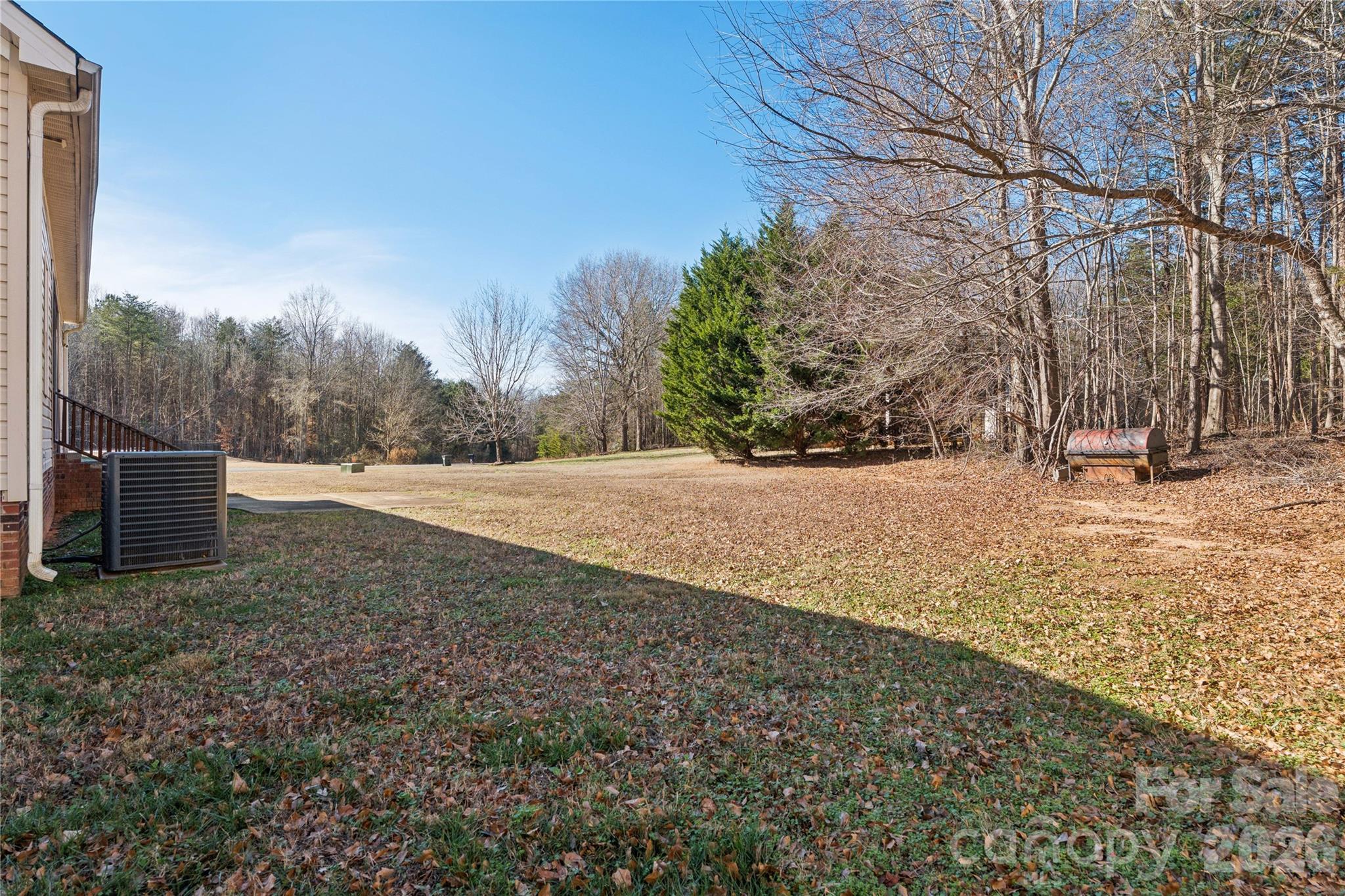 1308 Kerrington Way Clover, SC 29710 - Photo 25 of 33 a view of dirt yard with a large tree