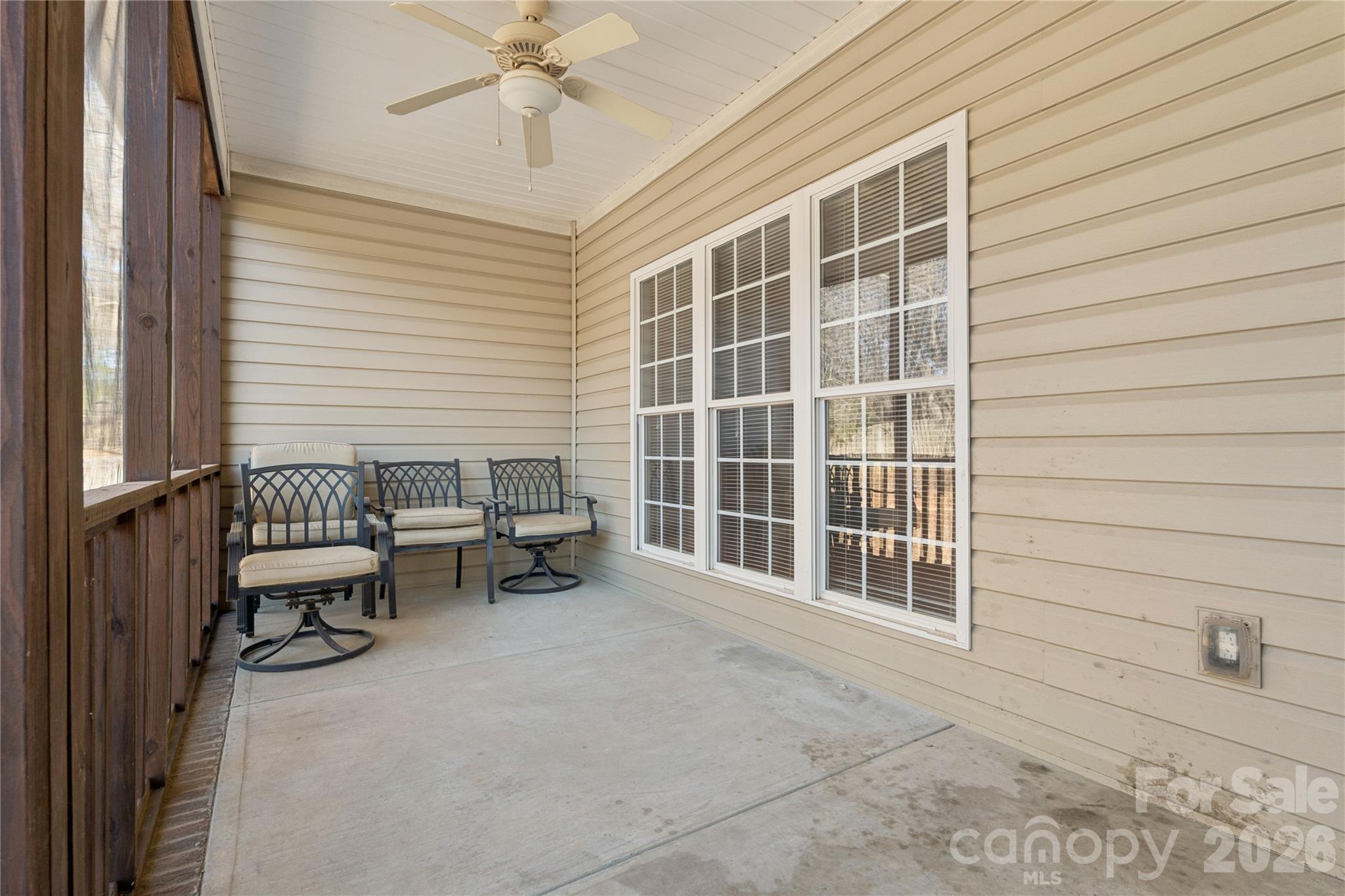 1308 Kerrington Way Clover, SC 29710 - Photo 29 of 33 a view of a patio with couches and table and chairs with wooden floor