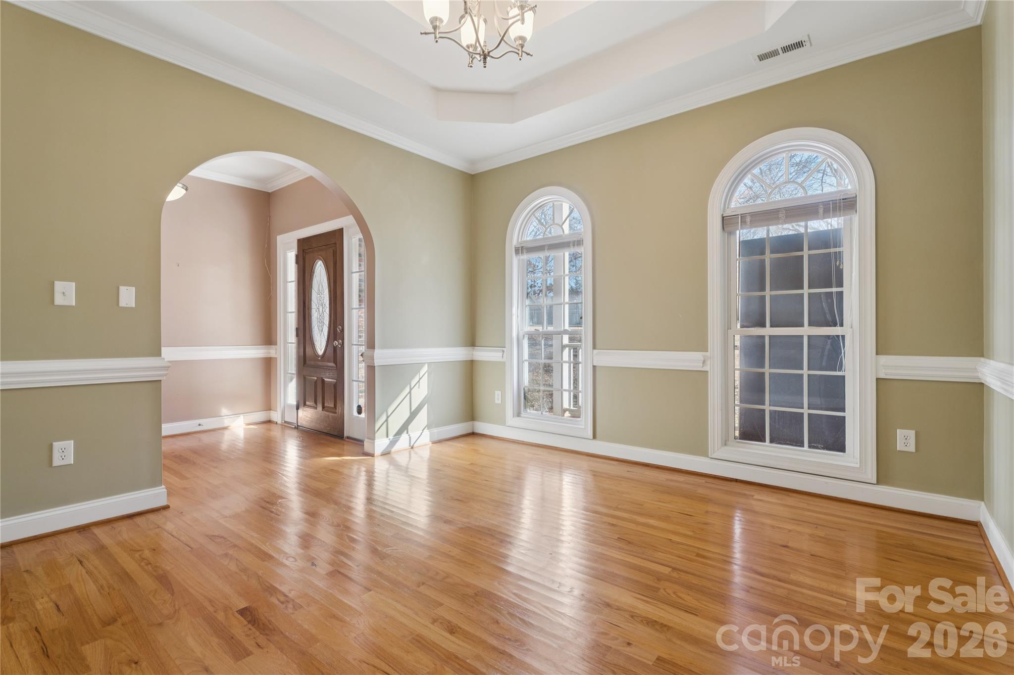 1308 Kerrington Way Clover, SC 29710 - Photo 5 of 33 a view of an empty room with window and wooden floor