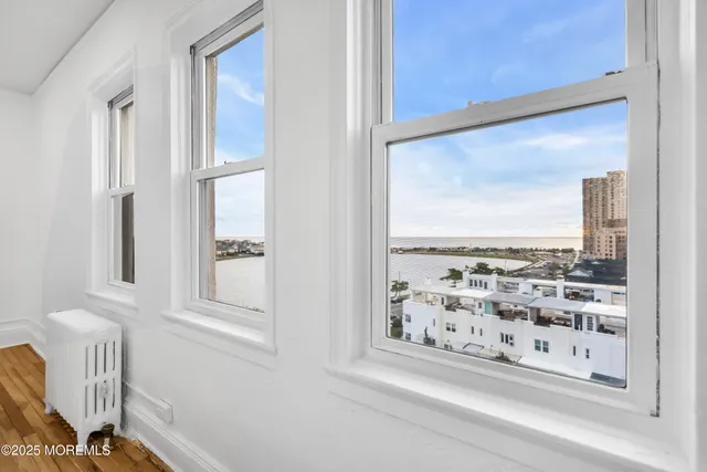 a view of a door with wooden floor and a windows