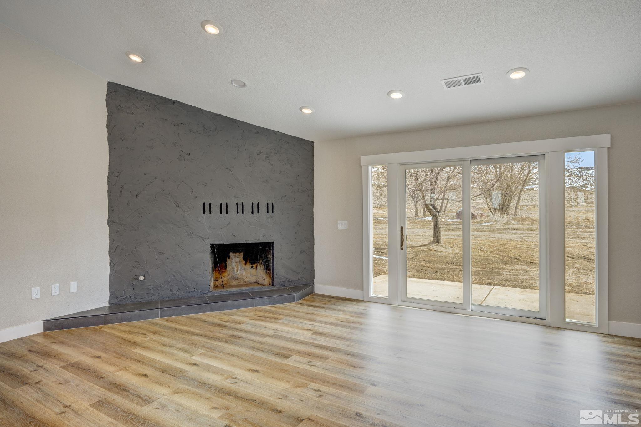 2900 Right Hand Canyon Road Reno, NV 89510 - Photo 15 of 29 a view of an empty room with a window and fireplace