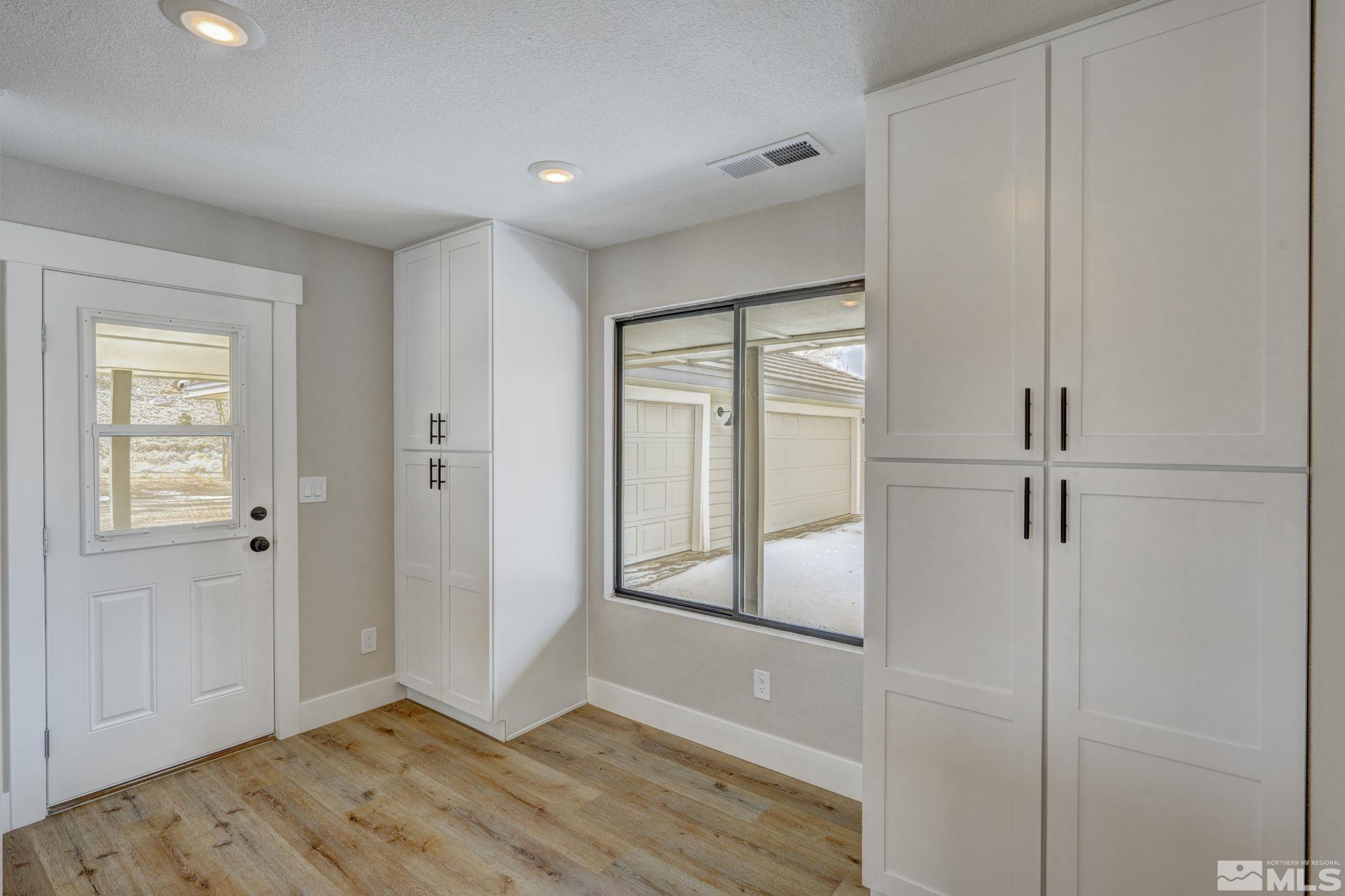 2900 Right Hand Canyon Road Reno, NV 89510 - Photo 23 of 29 a view of an empty room with wooden floor and a window
